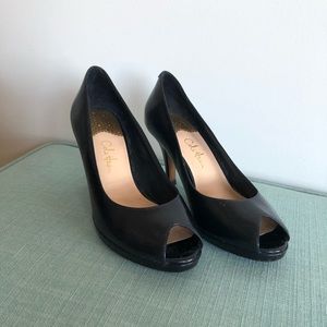Cole Haan & Nike Air navy leather peep toe pumps.